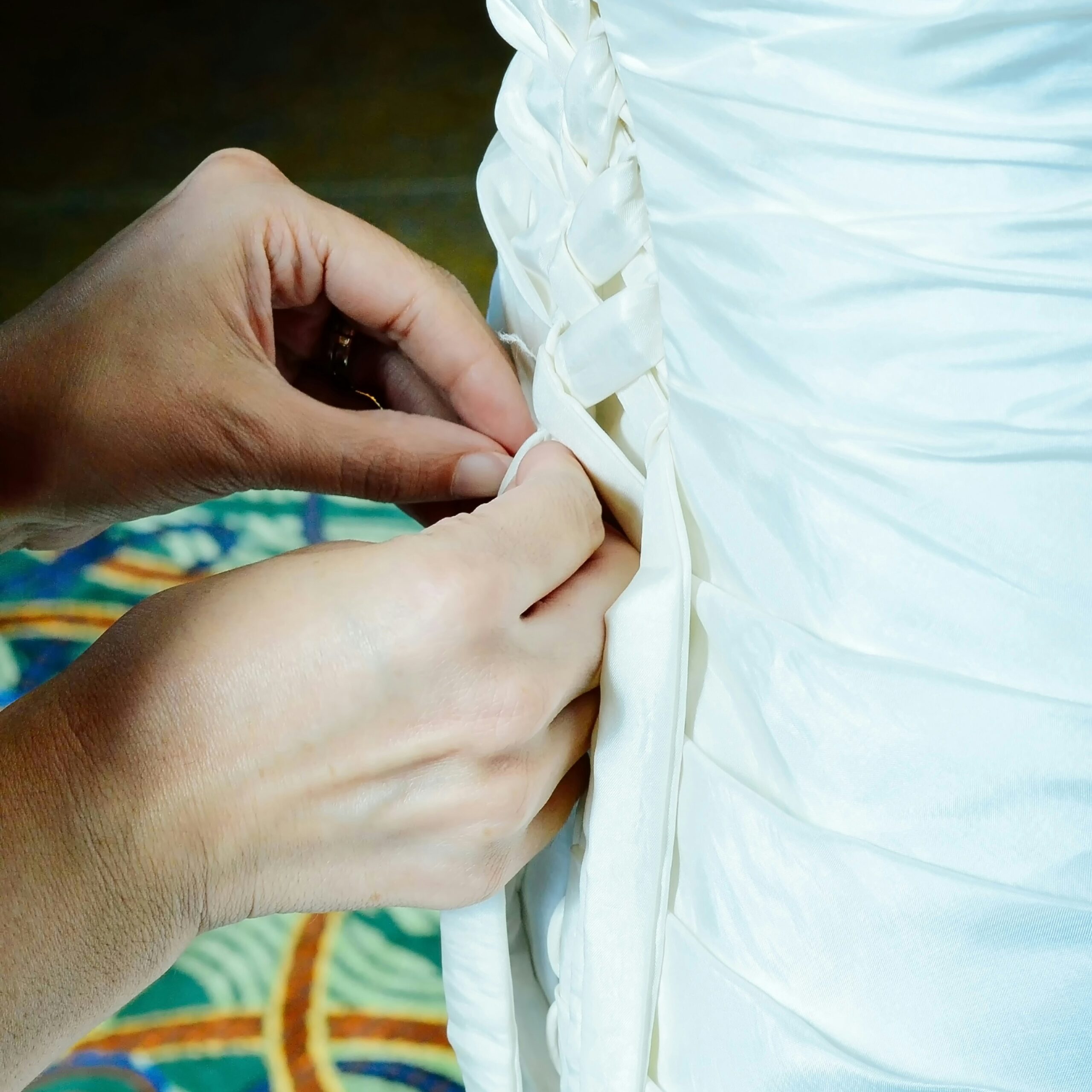 Calming hand ritual with fabric and thread